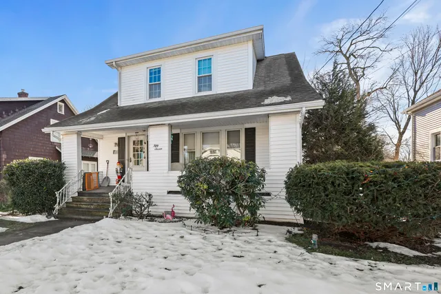 a front view of house with yard outdoor seating