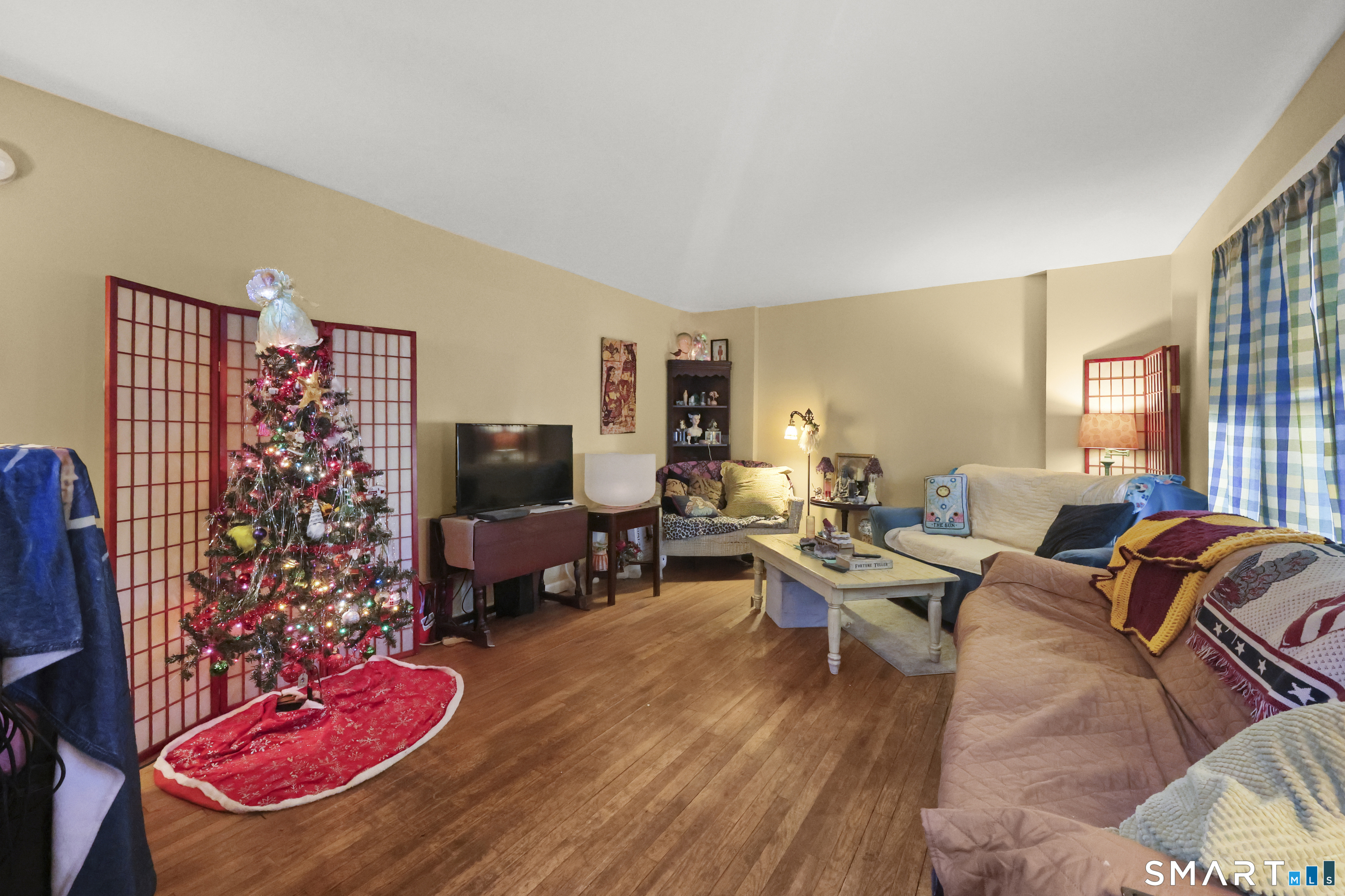 57 Foxon Place New Britain, CT 06053 - Photo 10 of 40 a living room with furniture floor and a flat screen tv