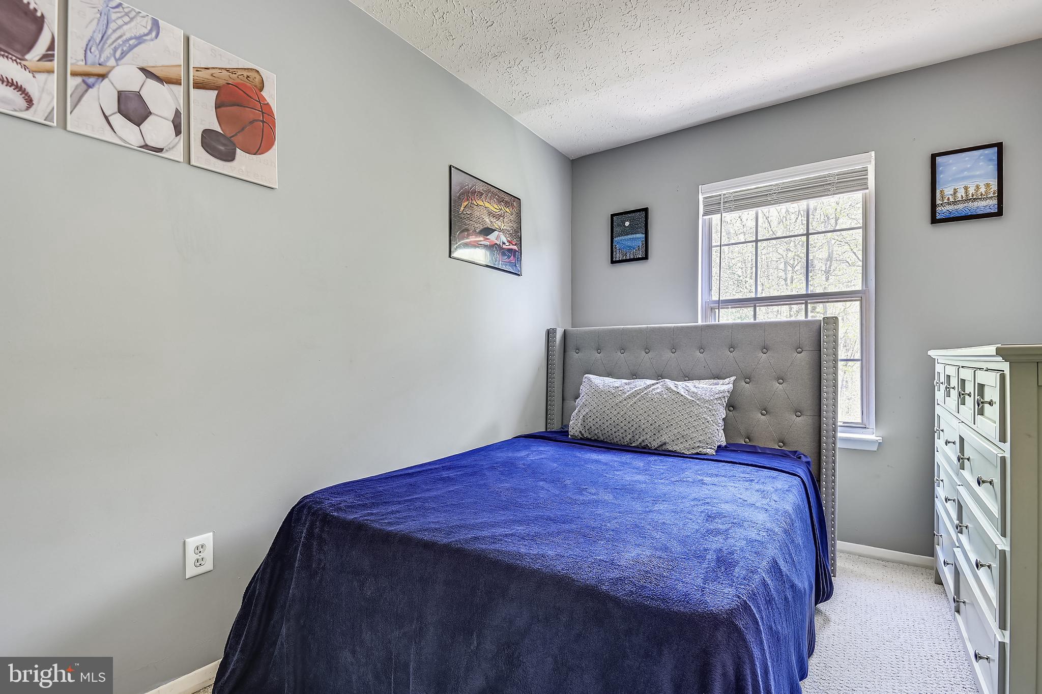 4087 Rustico Road Middle River, MD 21220 - Photo 17 of 26 2nd bedroom with window overlooking woods