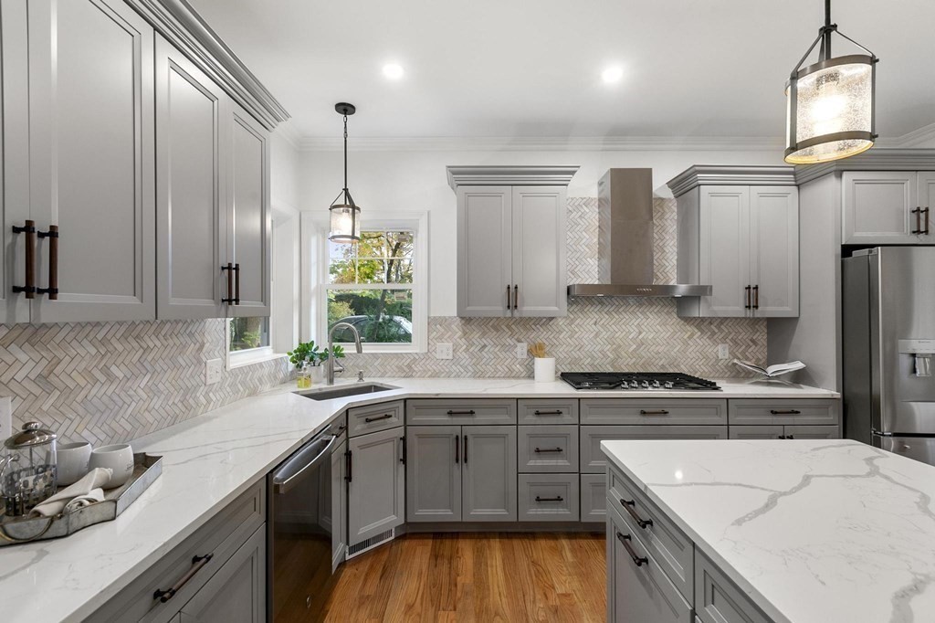 50 Azalea Circle Reading, MA 01867 - Photo 11 of 41 a kitchen with a sink stove and refrigerator