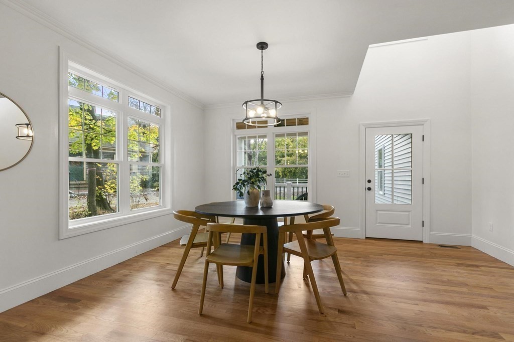 50 Azalea Circle Reading, MA 01867 - Photo 14 of 41 a view of a dining room with furniture window and wooden floor