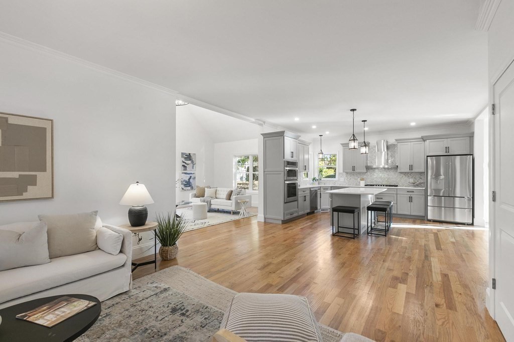 50 Azalea Circle Reading, MA 01867 - Photo 2 of 41 a living room with furniture and view of kitchen