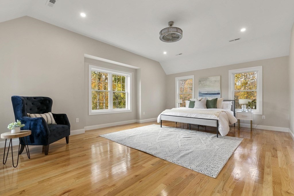 50 Azalea Circle Reading, MA 01867 - Photo 24 of 41 a bedroom with a bed and wooden floor