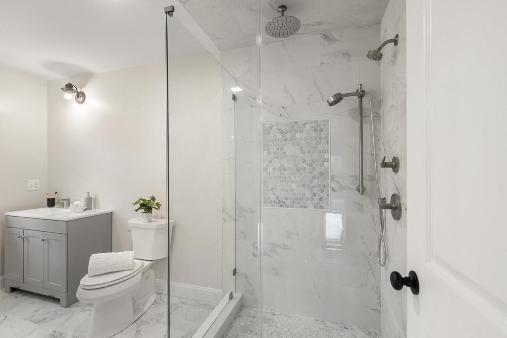 50 Azalea Circle Reading, MA 01867 - Photo 25 of 41 a bathroom with a sink toilet and shower