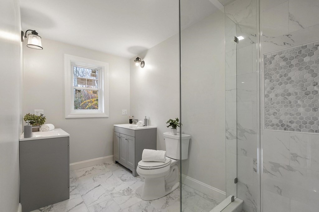 50 Azalea Circle Reading, MA 01867 - Photo 26 of 41 a bathroom with a bathtub a toilet and a shower