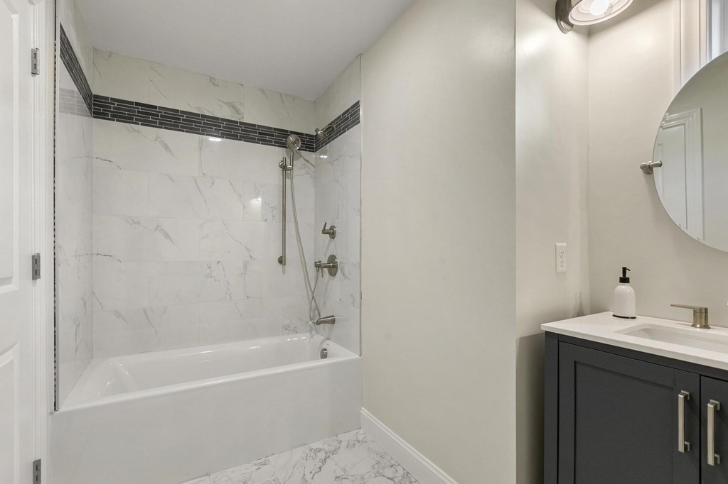 50 Azalea Circle Reading, MA 01867 - Photo 30 of 41 a bathroom with a shower and a sink