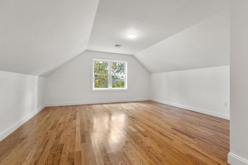50 Azalea Circle Reading, MA 01867 - Photo 35 of 41 an empty room with wooden floor and windows