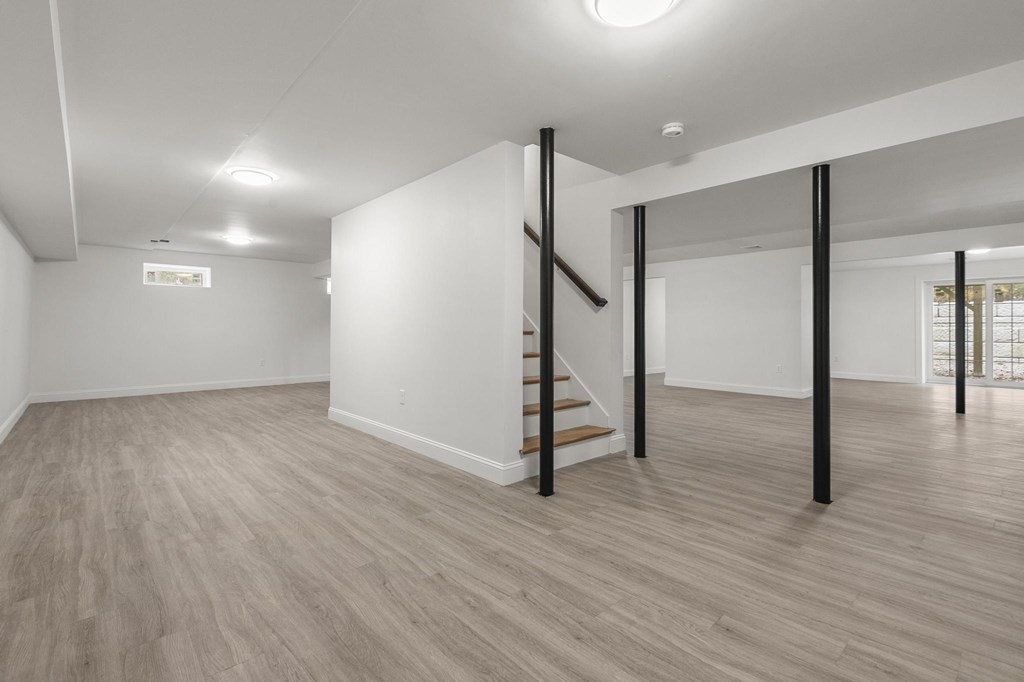 50 Azalea Circle Reading, MA 01867 - Photo 37 of 41 a view of a hallway with wooden floor