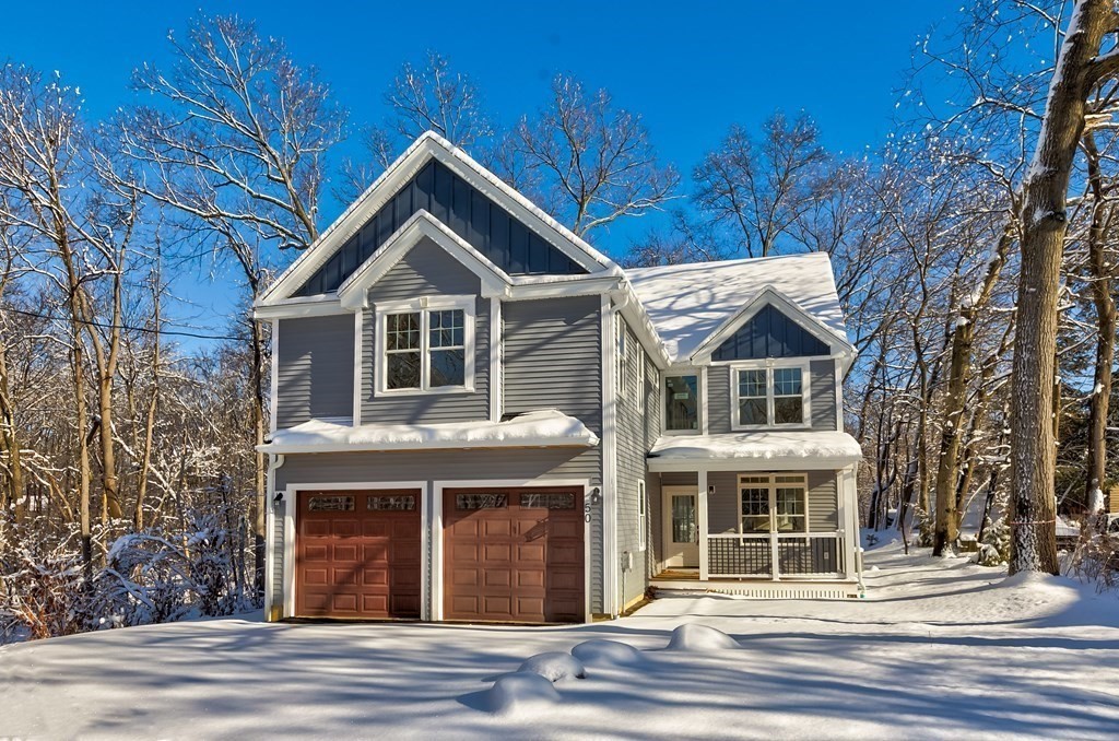 50 Azalea Circle Reading, MA 01867 - Photo 4 of 41 a front view of a house with a yard