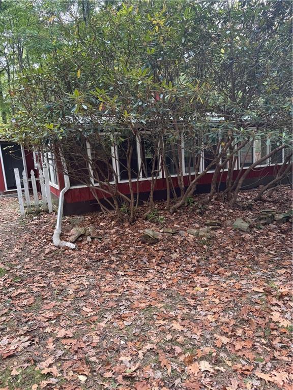 117 Chestnut Ridge Road Acme, PA 15610 - Photo 3 of 26 a backyard of a house with table and chairs