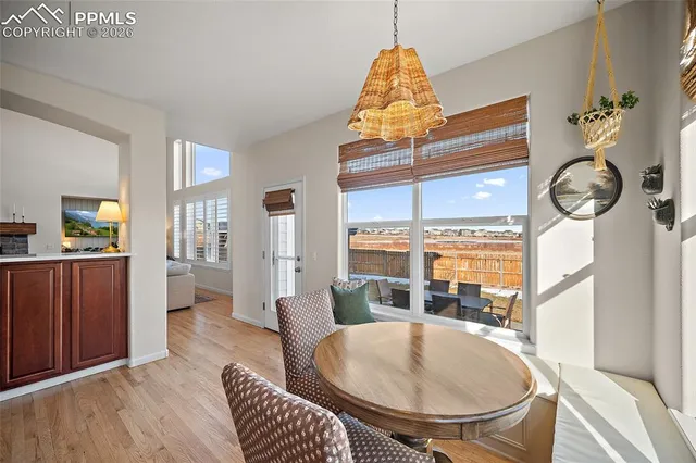 a dining room with furniture and window