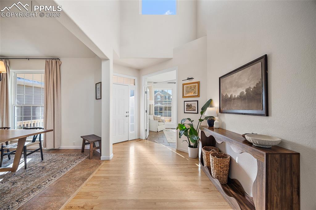 9393 St.George Road Peyton, CO 80831 - Photo 25 of 49 a living room with furniture a wooden floor and next to a window