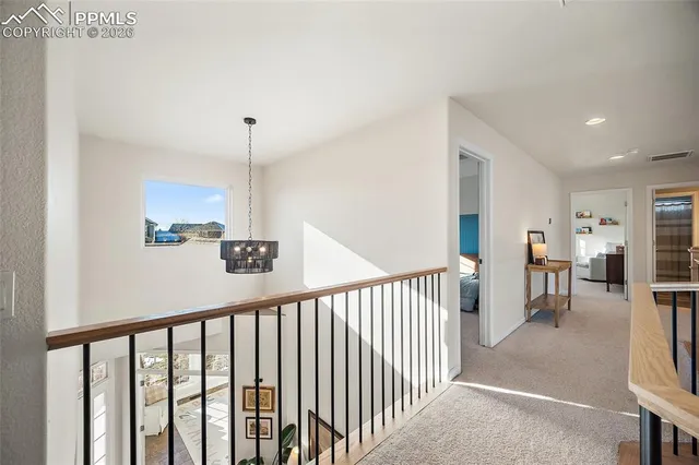 a view of a hallway with seating area