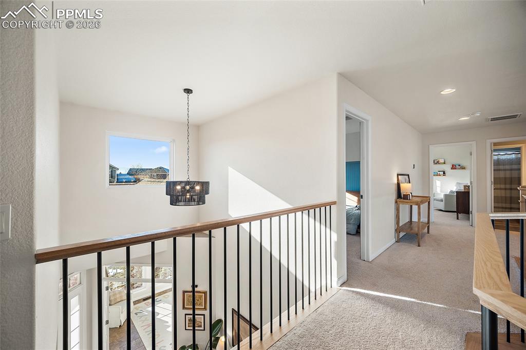 9393 St.George Road Peyton, CO 80831 - Photo 27 of 49 a view of a hallway with seating area