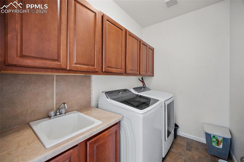 9393 St.George Road Peyton, CO 80831 - Photo 30 of 49 a utility room with dryer and washer