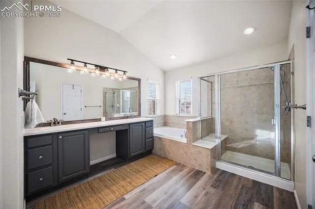 a large spacious bathroom with a large tub shower and sink