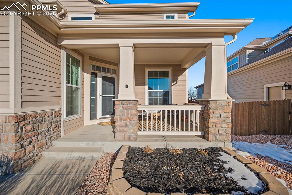 9393 St.George Road Peyton, CO 80831 - Photo 4 of 49 a view of a porch with a table and chairs