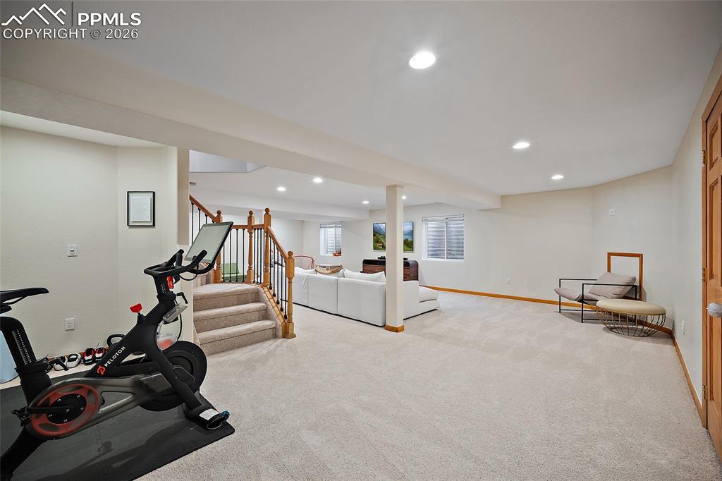 9393 St.George Road Peyton, CO 80831 - Photo 41 of 49 a view of a livingroom with furniture and a gym equipment