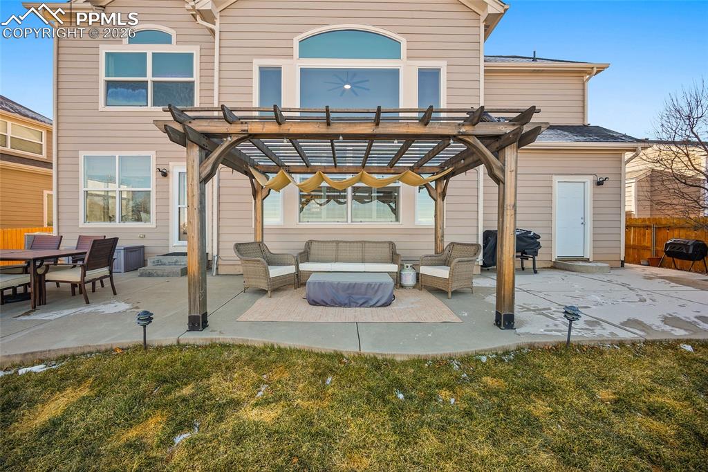 9393 St.George Road Peyton, CO 80831 - Photo 45 of 49 a front view of a house with swimming pool patio and glass windows