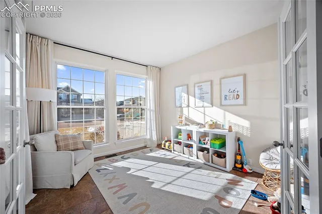 a living room with furniture and a window