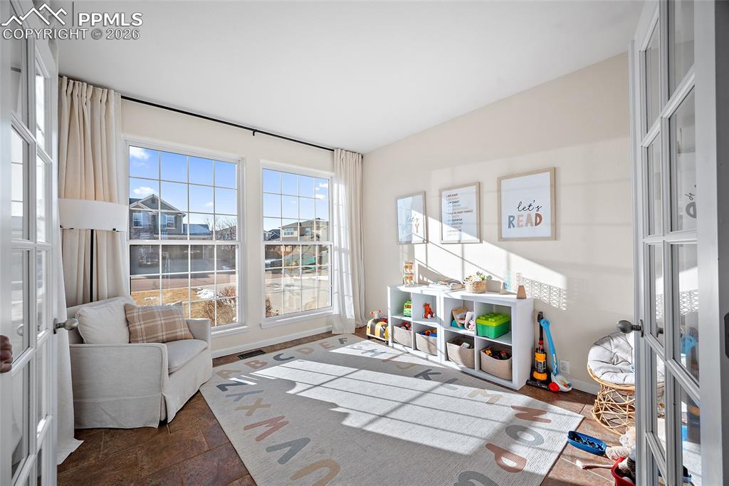 9393 St.George Road Peyton, CO 80831 - Photo 6 of 49 a living room with furniture and a window