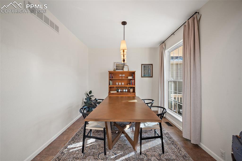 9393 St.George Road Peyton, CO 80831 - Photo 8 of 49 a view of a dining room with furniture window and wooden floor