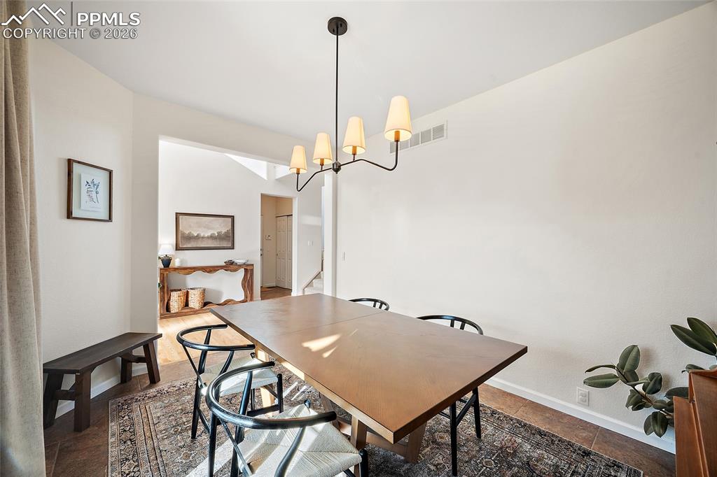 9393 St.George Road Peyton, CO 80831 - Photo 9 of 49 a view of a room that has a table and chairs in it