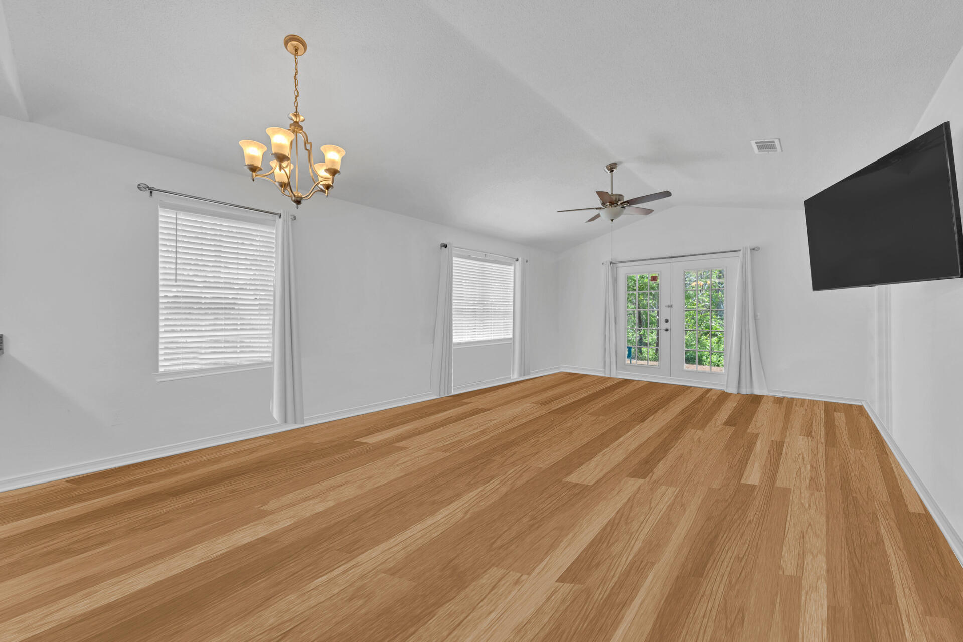 84 Vicki Street Santa Rosa Beach, FL 32459 - Photo 13 of 39 a view of an empty room with a window and wooden floor