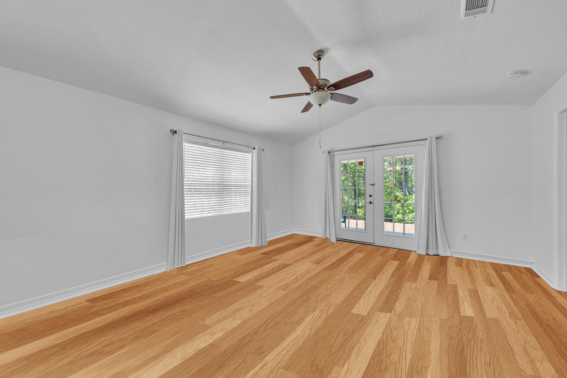 84 Vicki Street Santa Rosa Beach, FL 32459 - Photo 20 of 39 a view of empty room with wooden floor and fan