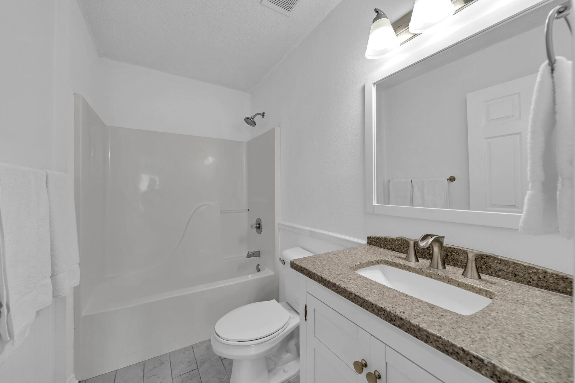 84 Vicki Street Santa Rosa Beach, FL 32459 - Photo 25 of 39 a bathroom with a granite countertop sink toilet and shower