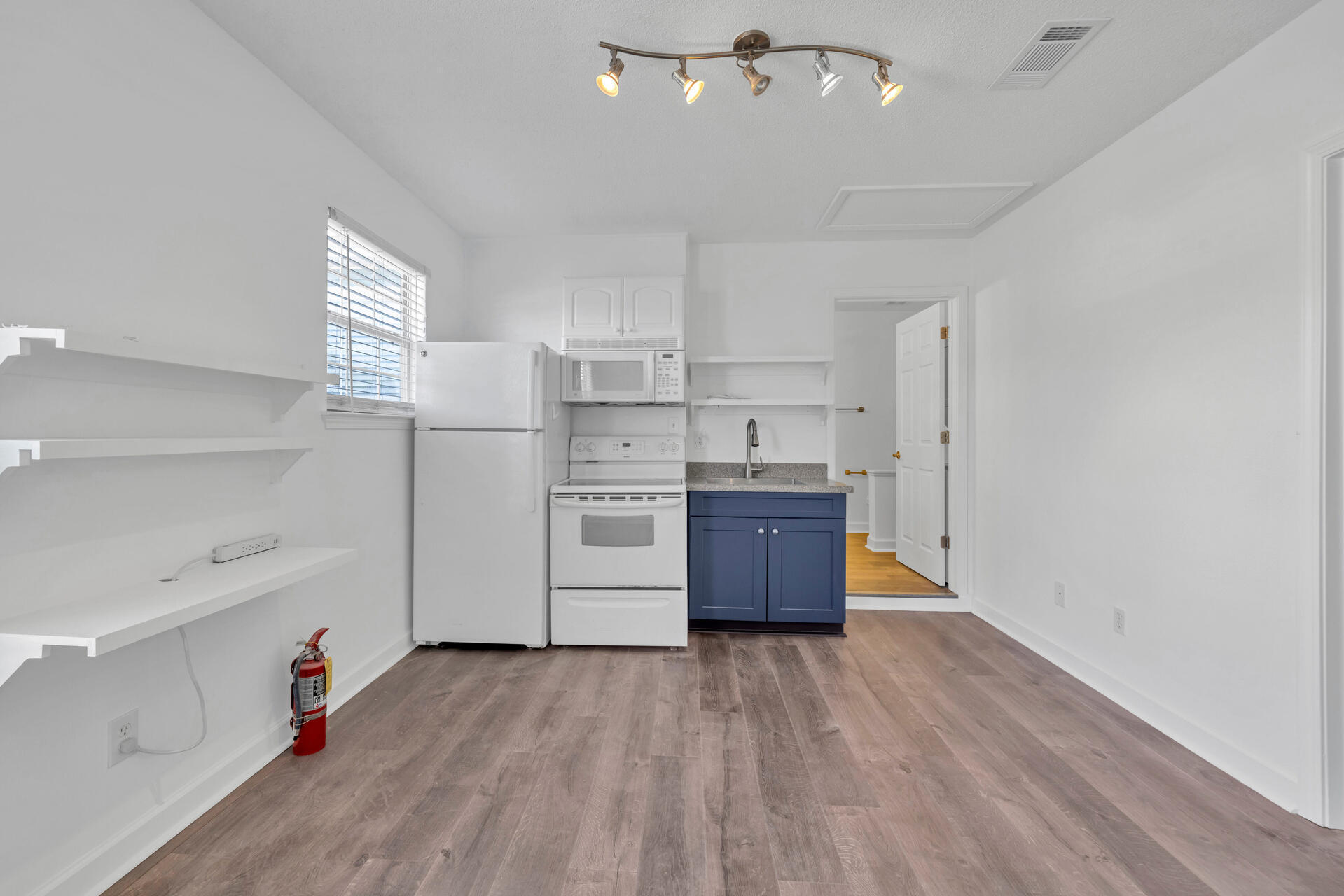 84 Vicki Street Santa Rosa Beach, FL 32459 - Photo 33 of 39 a kitchen with stainless steel appliances a refrigerator and a wooden floor