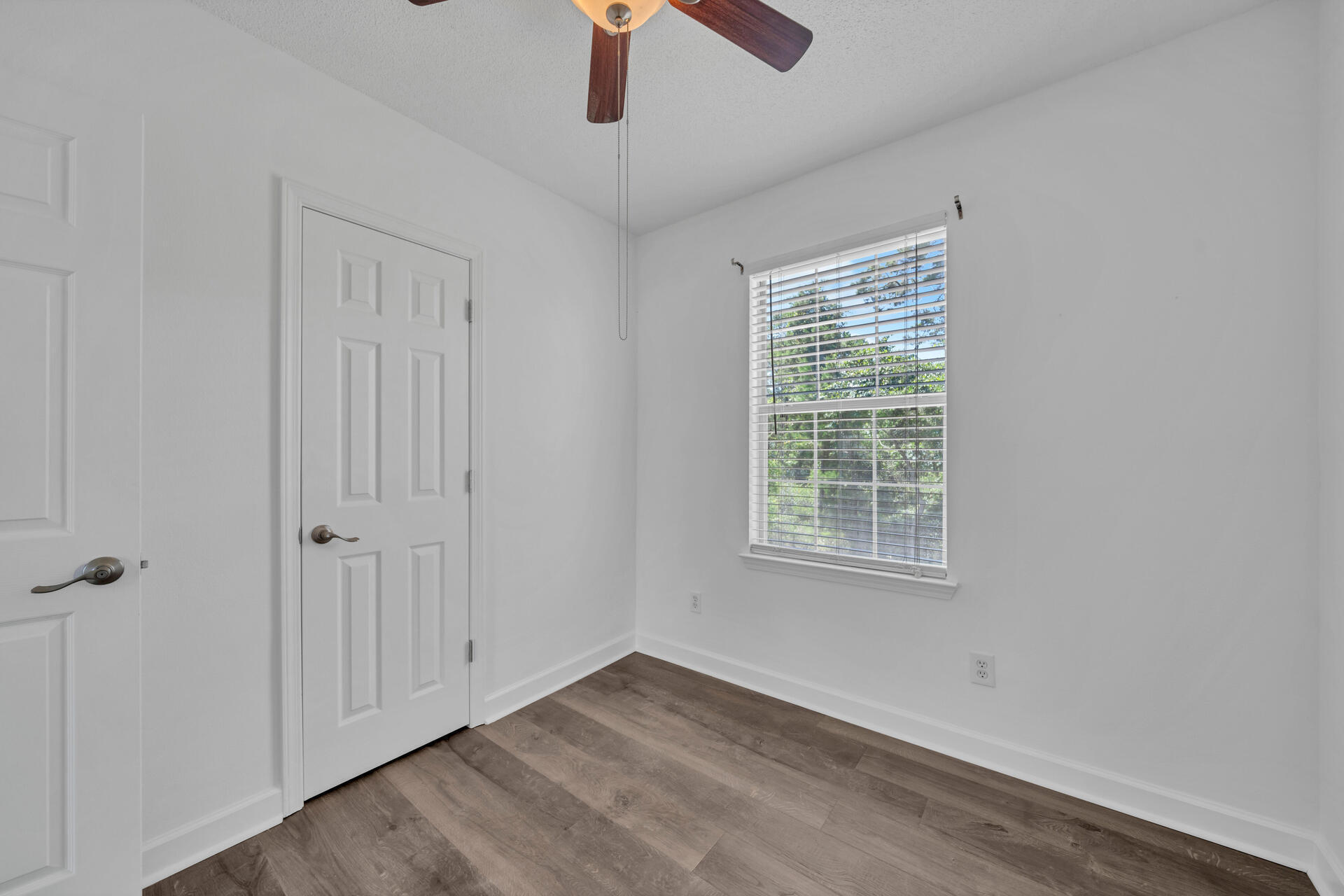 84 Vicki Street Santa Rosa Beach, FL 32459 - Photo 38 of 39 a view of an empty room with chandelier fan and window
