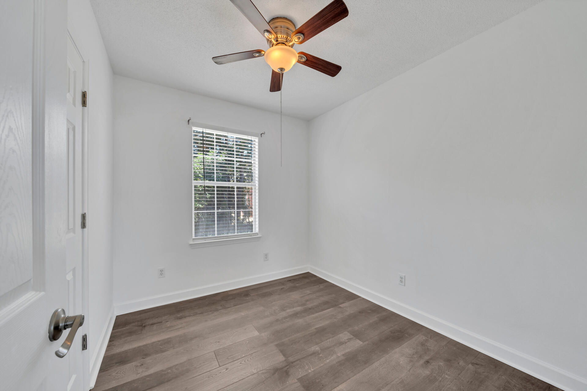 84 Vicki Street Santa Rosa Beach, FL 32459 - Photo 39 of 39 wooden floor in an empty room with a window