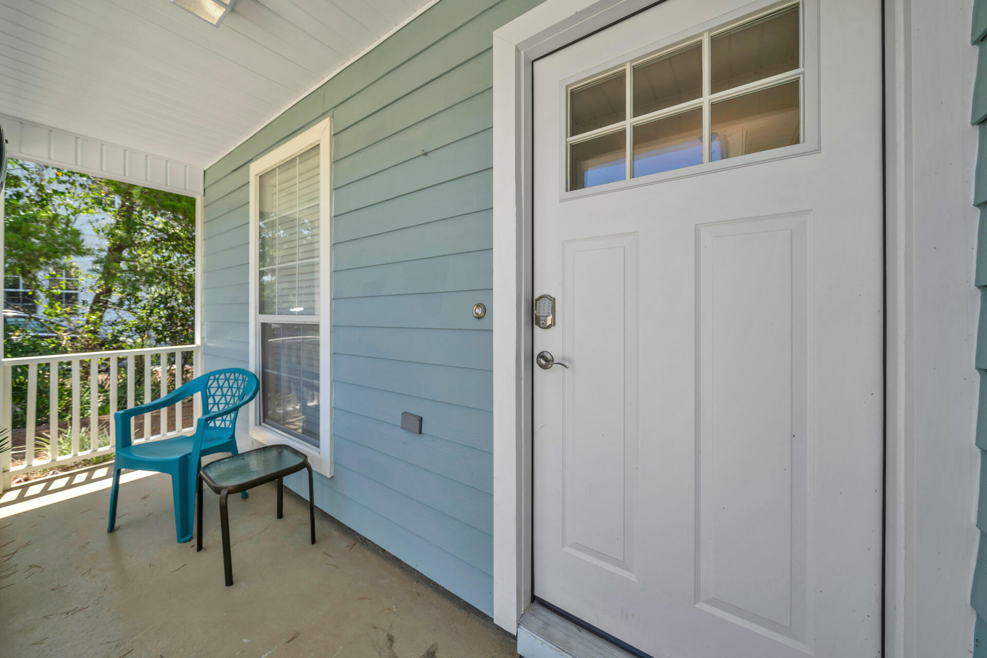 84 Vicki Street Santa Rosa Beach, FL 32459 - Photo 5 of 39 a view of a porch with chairs and front door