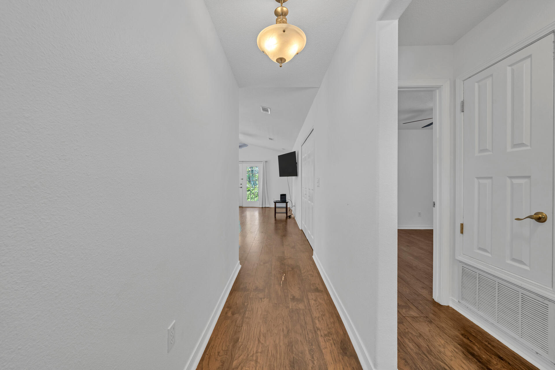 84 Vicki Street Santa Rosa Beach, FL 32459 - Photo 6 of 39 a view of a hallway with wooden floor