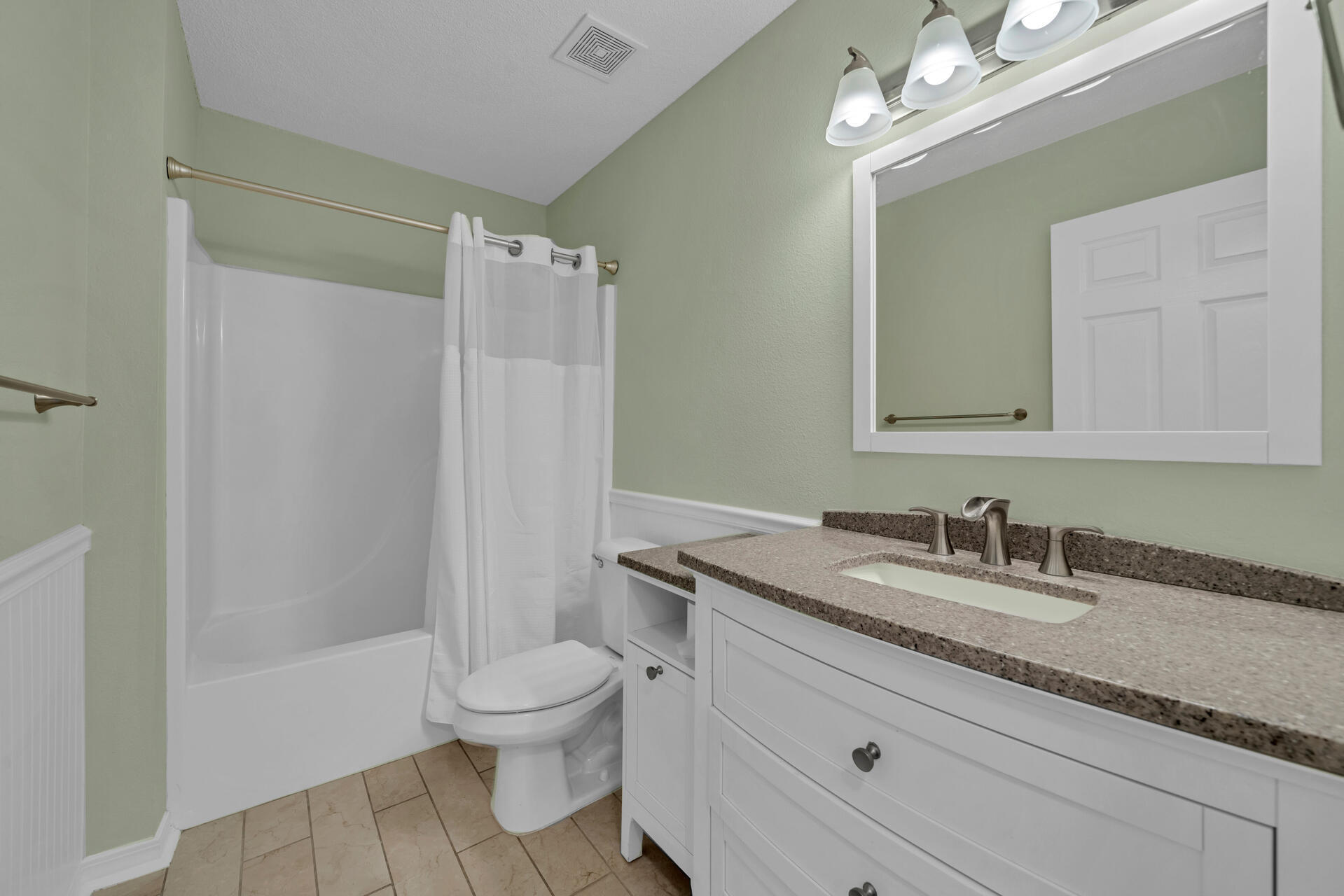 84 Vicki Street Santa Rosa Beach, FL 32459 - Photo 7 of 39 a bathroom with a granite countertop sink a toilet a mirror and shower