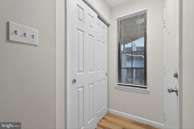 a view of a hallway with closet and entryway