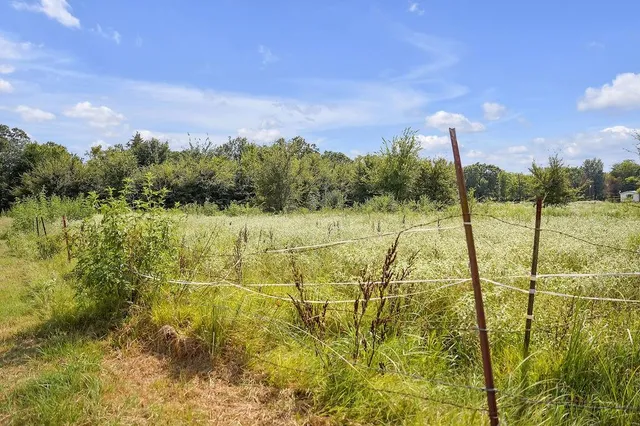 a view of a lake with a big yard