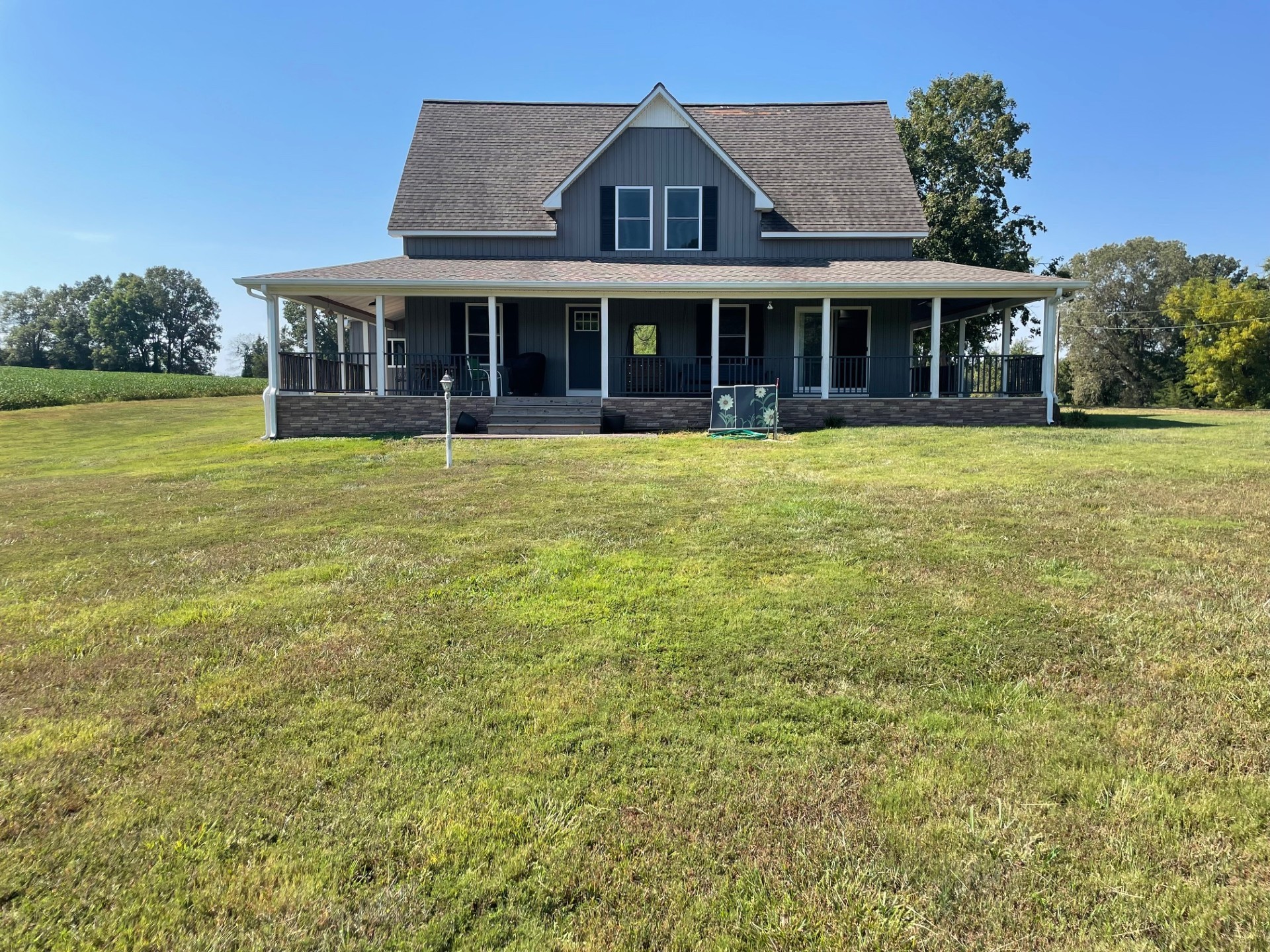 a front view of a house with a garden