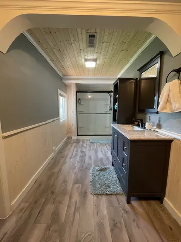 a bathroom with a sink and a mirror
