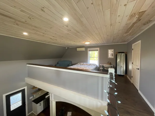 a view of a hallway with kitchen