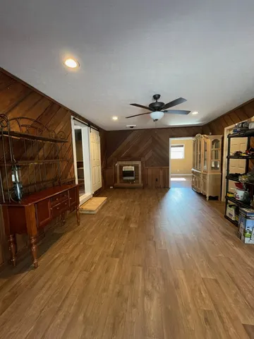 a view of a livingroom with wooden floor