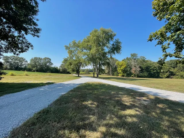 a view of a swimming pool with a yard