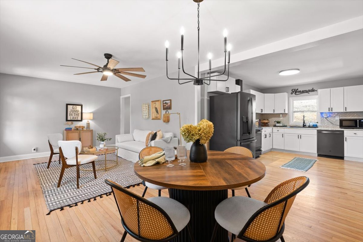 80 Hand Road Bowdon, GA 30108 - Photo 13 of 82 a view of a dining room with furniture and wooden floor