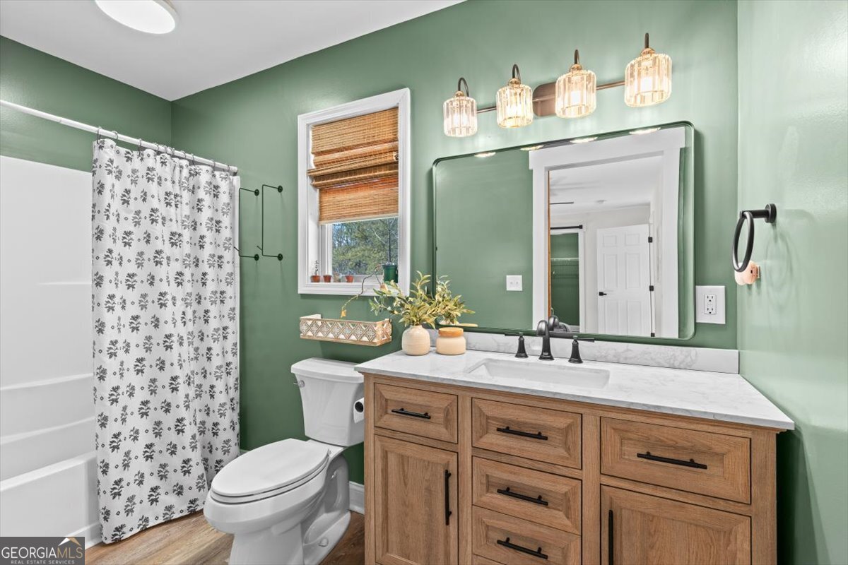 80 Hand Road Bowdon, GA 30108 - Photo 20 of 82 a bathroom with a sink toilet and a mirror