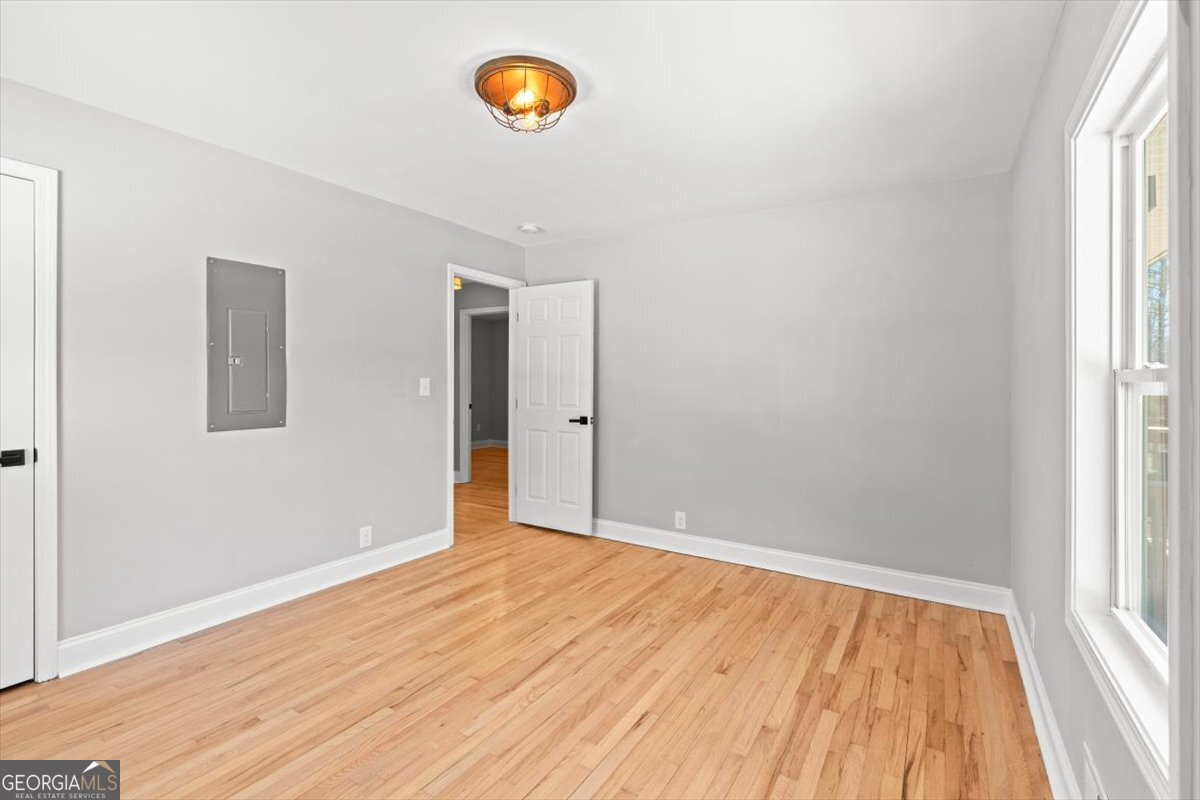 80 Hand Road Bowdon, GA 30108 - Photo 21 of 82 wooden floor in an empty room with a window