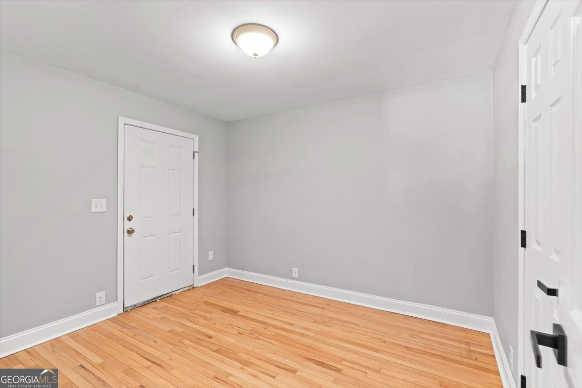 80 Hand Road Bowdon, GA 30108 - Photo 23 of 82 a view of empty room with wooden floor