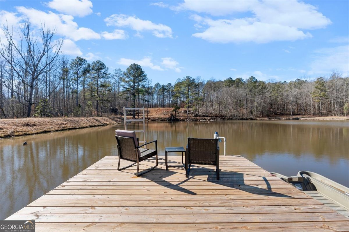 80 Hand Road Bowdon, GA 30108 - Photo 29 of 82 a view of a lake with houses
