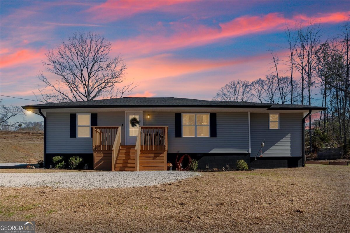 80 Hand Road Bowdon, GA 30108 - Photo 46 of 82 a front view of a house with a yard and garage