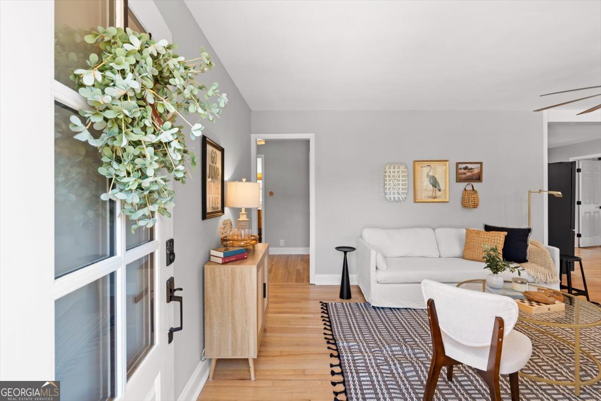 80 Hand Road Bowdon, GA 30108 - Photo 5 of 82 a living room with furniture and a potted plant
